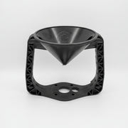 Black 3D-printed object with a funnel-like top on a white background