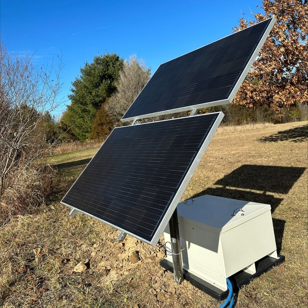 Solar pond aerator with battery backup and NightAir 2.2 CFM compressor for off-grid ponds.