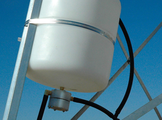 A freeze control unit on a windmill frame.