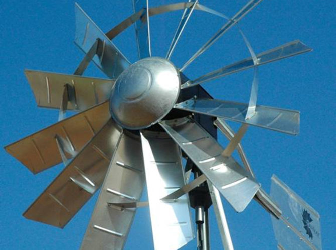 A windmill head on a sky background.