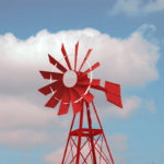 A red and white background against a blue sky.