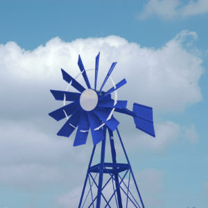 A blue and white windmill on a blue sky background.