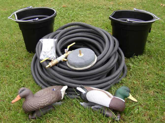 A medium pond accessory kit including 2 buckets, 1 airstone, two ducks, a roll of hose and a connector.