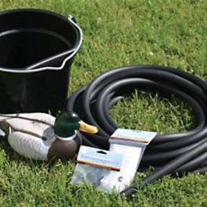 A Deluxe Accessory Kit with hose, bucket, and duck on grass.