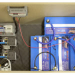 Interior of an aeration kit with four batteries.