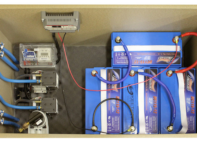Interior of an aeration kit with four batteries.