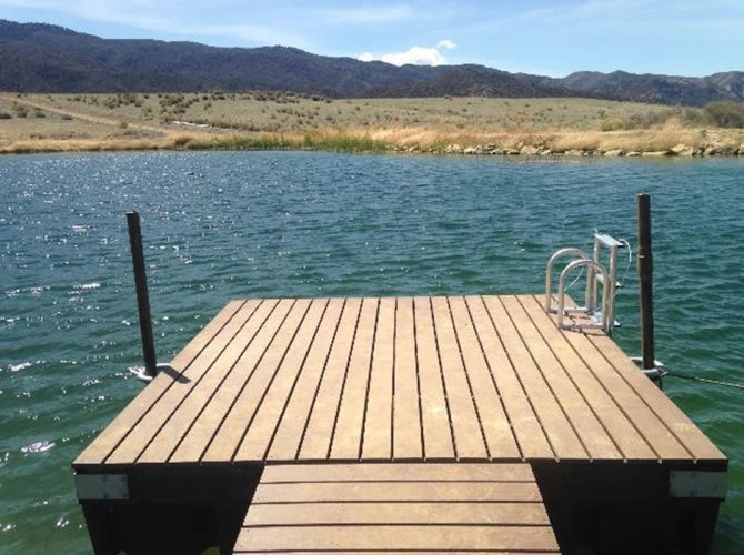 A 10 foot by 10 foot swim platform in a pond.