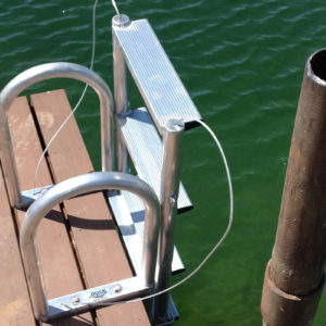 A Floating Dock Ladder on a dock in a pond.