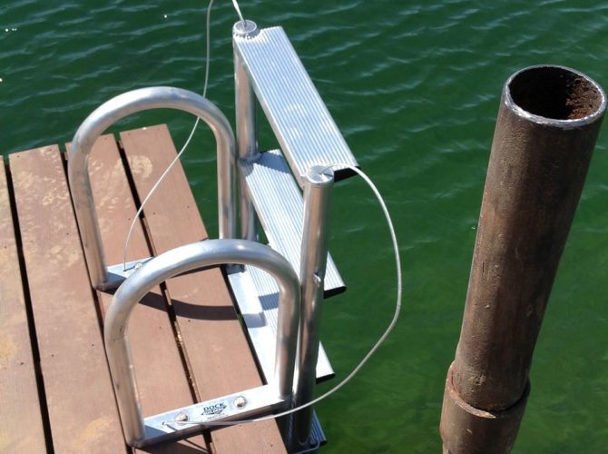 A Floating Dock Ladder on a dock in a pond.