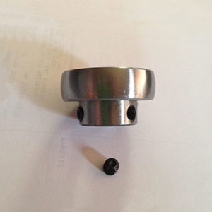 A silver colored fan replacement bearing with small black screw.