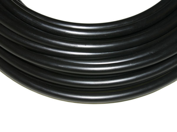 Close up of black 1/2 inch poly tubing.