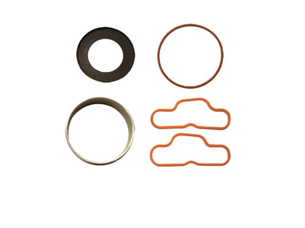 One thick black gasket, one thin red gasket, two thin light red gaskets and one metal cylender