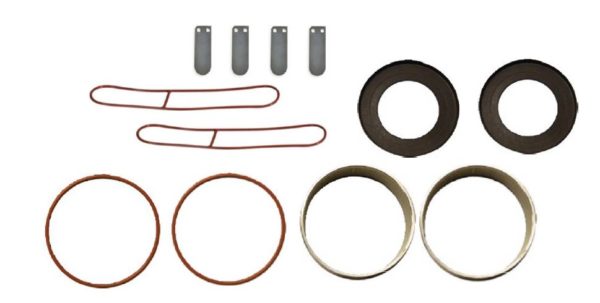 Gast 3/4 HP Replacement Rocking Piston Maintenance Kit. Two red round gaskets, four metal rings, two of which are thick and two are thin. Two red oblong gaskets and 4 spacers.