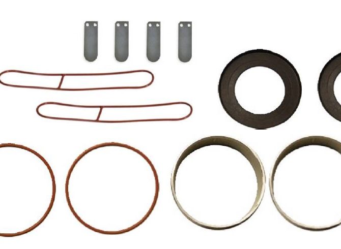 Gast 3/4 HP Replacement Rocking Piston Maintenance Kit. Two red round gaskets, four metal rings, two of which are thick and two are thin. Two red oblong gaskets and 4 spacers.