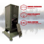 The H125 Fish Feeder against a background with fog, trees, and water. The side panel is removed and proper against the side of the machine.
