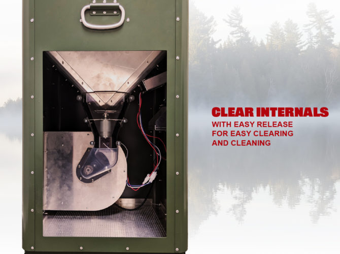 The H125 Fish Feeder against a background with fog, trees, and water. The side panel has been removed to show the internals of the unit. There is a metal funnel that feeds down to the motor to spray food.