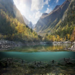 Image showing a pond with mountains in the background and the Essential Shoreline Bundle - Mossback in the foreground.